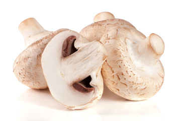 Fototapeta na wymiar Fresh champignon mushrooms isolated on white background
