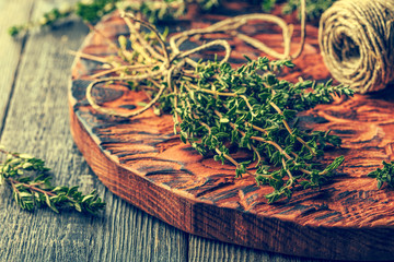 Thyme on old wooden board