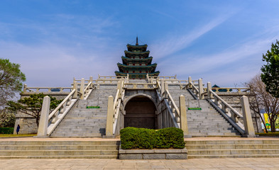 Gyeongbokgung Palace In South Korea, with the name of the palace 'Gyeongbokgung' on a sign