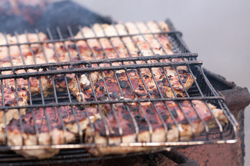 Grilling skewers or shashlik on barbecue grill. Selective focus