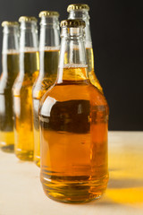 Beer bottles on a wooden table .