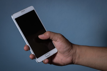 hand hold smartphone with light and shadow