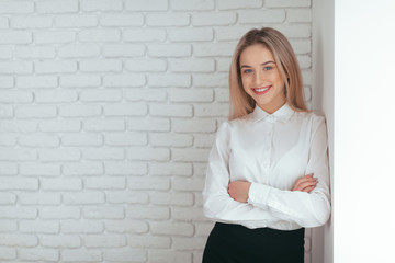 Portrait of beautiful young woman working in the office.