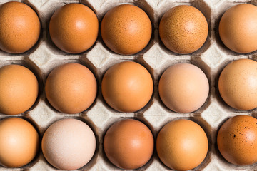 Eggs in the package on table , top view