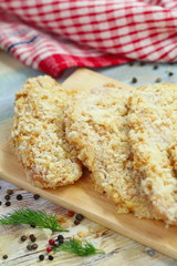 Raw chicken fillet in bread crumbs prepared for cook