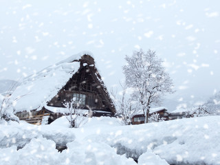 japanese house was coverred by snow in snowing day