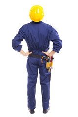 Back view of a young worker standing on white background