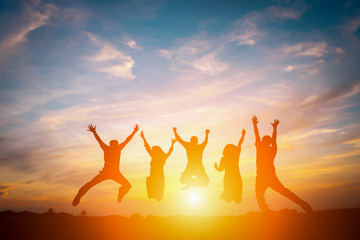 Silhouette of happy business team making high hands in sunset sky background for business teamwork concept. - 142932903