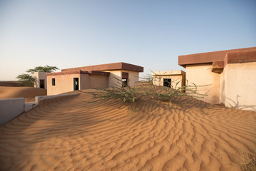 Fototapeta na wymiar Abandoned ghost village in Arabian desert.