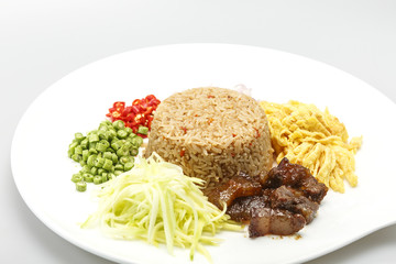 Asian food. Rice Seasoned With Shrimp Paste (Khaao Khlook Gabpi) on wooden background on isolated  white background