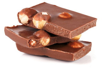 Chocolate with hazelnuts isolated on white background