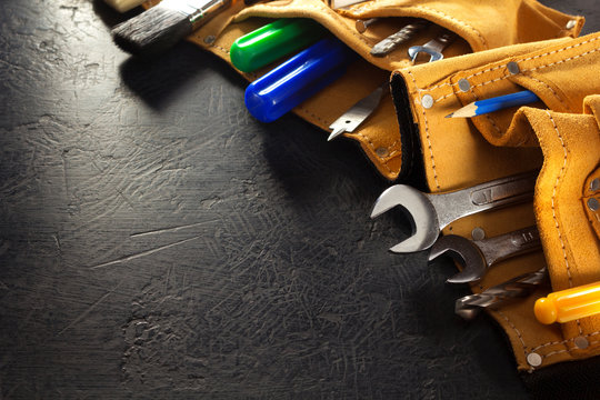 tools and instruments in belt on black