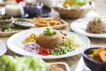 Asian food. Rice Seasoned With Shrimp Paste (Khaao Khlook Gabpi) on wooden background