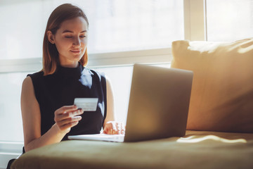 Girl making online shopping and using credit card, Blogger waiting for confirmation of her online...