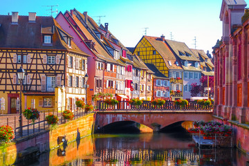 Beautiful late summer afternoon view of traditional colorful half-timbered buildings in the historical old town of Colmar, Alsace wine region in France - obrazy, fototapety, plakaty