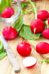 Fresh radishes on wooden table