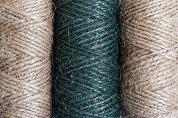 Textile background with thread in bobbins