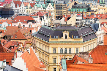 Fototapeta na wymiar Aerial cityscape view of houses and orange roofs typical of Prague