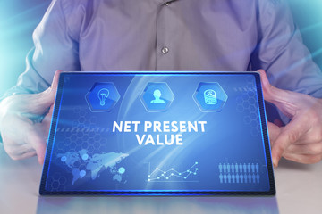 Business, Technology, Internet and network concept. Young businessman working on a virtual screen of the future and sees the inscription: Net present value