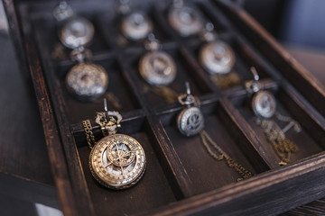 Many old pocket clock on wooden desk