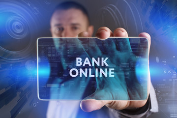 Business, Technology, Internet and network concept. Young businessman working on a virtual screen of the future and sees the inscription: Bank online