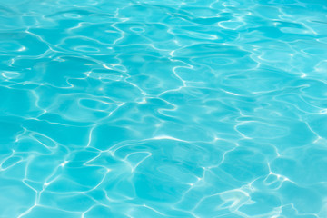 Obraz na płótnie Canvas Beautiful ripple wave and blue water surface in swimming pool