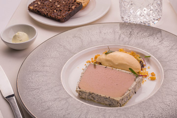 Guinea fowl liver parfait with black truffle, plumps jam, ice-cream with pone flavor