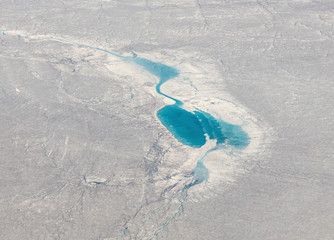 Lake appearing on the ice dome of Iceland in the area between Narsarsuaq and Frederikshab. This is a consequence of the phenomenon of global warming and catastrophic thawing of ice, Greenland © vadim_petrakov