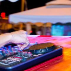 Dj mixing in nightclub at party.