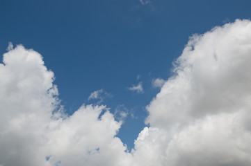White clouds in the blue sky.
