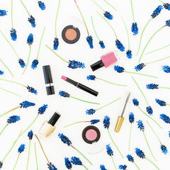 Blue muscari and woman cosmetics on white background. Flat lay, top view. Spring background.