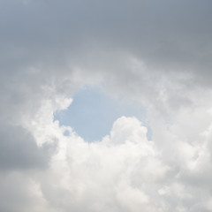 White clouds in the blue sky.