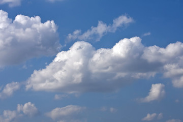 Naklejka na ściany i meble Heavy rain clouds in the blue sky