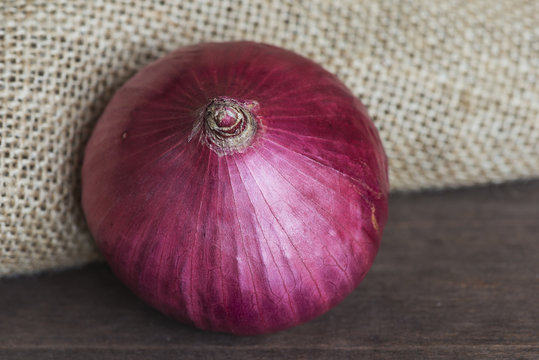 red oinion on a rustic background