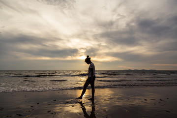 A girl walking on the beach