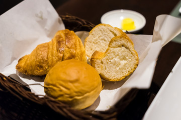 Sliced bread with cream cheese and butter for dinner