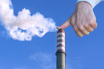 Man with hand making stop to environmental pollution