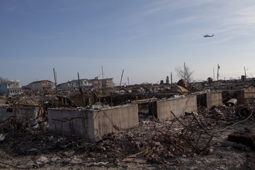 Obraz na płótnie Canvas NEW YORK -November12: The fire destroyed around 100 houses during Hurricane Sandy in the flooded neighborhood at Breezy Point in Far Rockaway area on October 29; 2012 in New York City; NY
