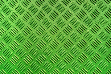 Fototapeta na wymiar Green metal surface background with repeative diamond pattern