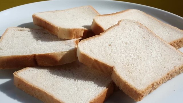 slices of toast bread on rotating plate
