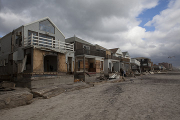 Obraz na płótnie Canvas NEW YORK - October 31:Destroyed homes in Far Rockaway after Hurricane Sandy October 29, 2012 in New York City, NY