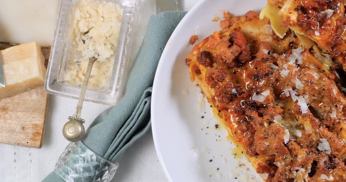Dolly top down close up view of delicious steamy lasagne in bolognese sauce