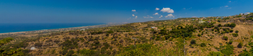 Fototapeta na wymiar Agia Irini, Greece. July 27. 2016: Panoramic view to mountains from Agia Irini Monastery, wide panorama.