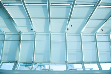 the metal and glass roof of a mall