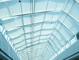 the metal and glass roof of a mall