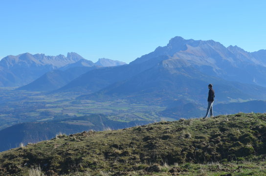 Hiker contemplating the Obiou mountain in the Tri&egrave;ves region from the Connex Mountain, Alps, France