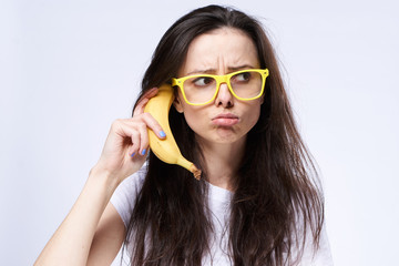 discouragement, women, yellow glasses and banana