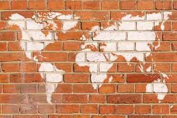 Antique brick wall with World map graffiti
