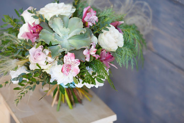 Bridal bouquet. The bride's bouquet. Beautiful bouquet of Succulents, pink flowers and greenery...