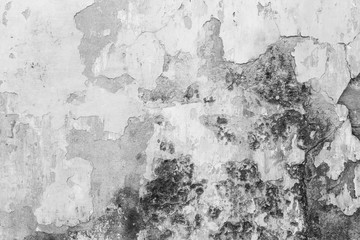 Weathered, faded and peeled off concrete wall texture background in black&white.